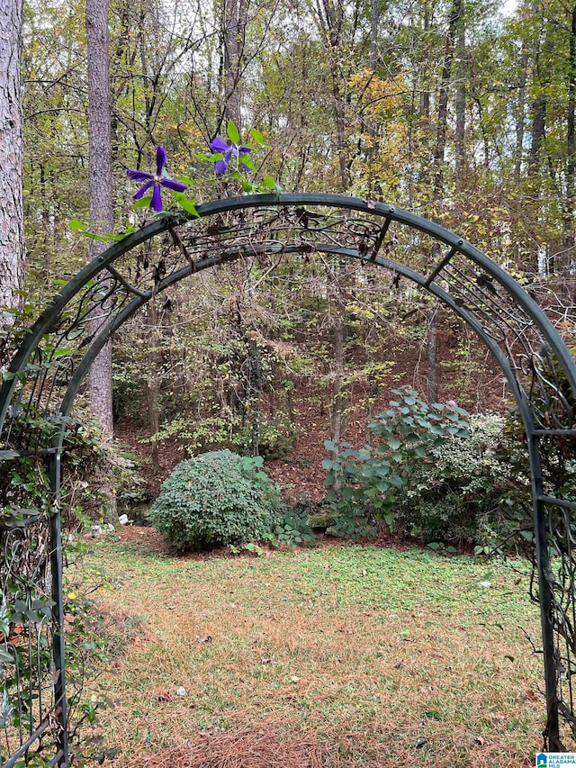 view of gate featuring a lawn