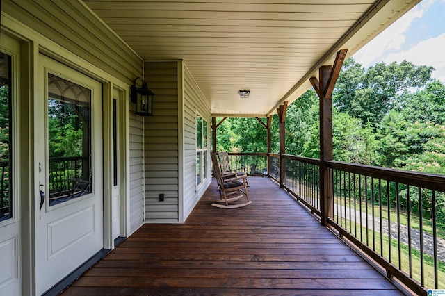 wooden terrace featuring a porch