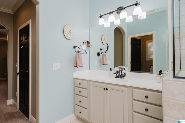 bathroom with vanity and crown molding