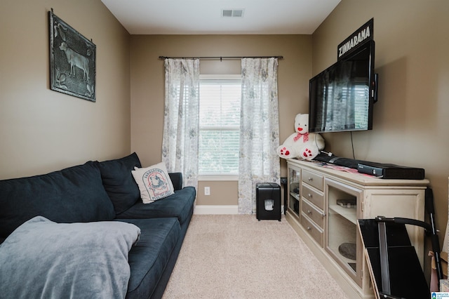 living area featuring light colored carpet