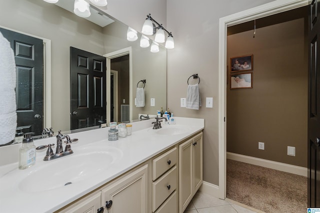 bathroom featuring tile patterned flooring and vanity