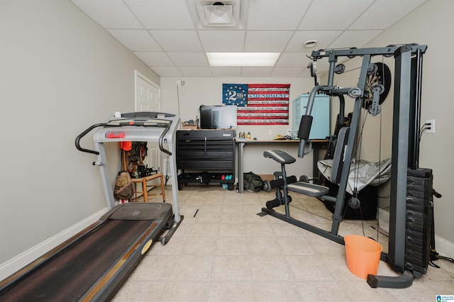 exercise area featuring a paneled ceiling