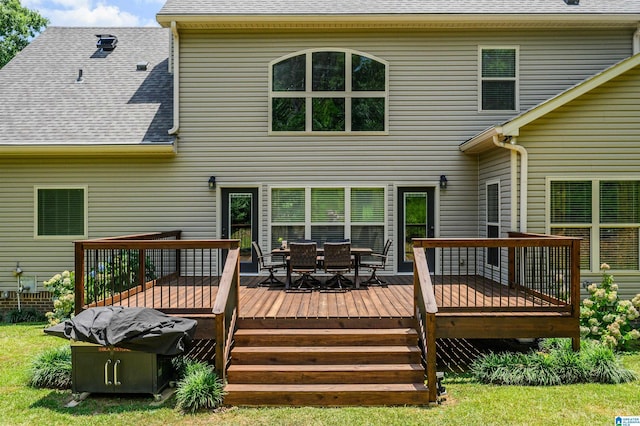 rear view of house featuring a deck