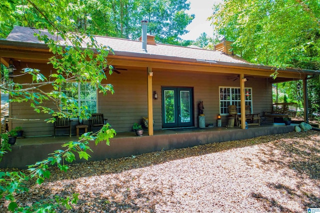 view of front facade featuring french doors, ceiling fan, and a patio area