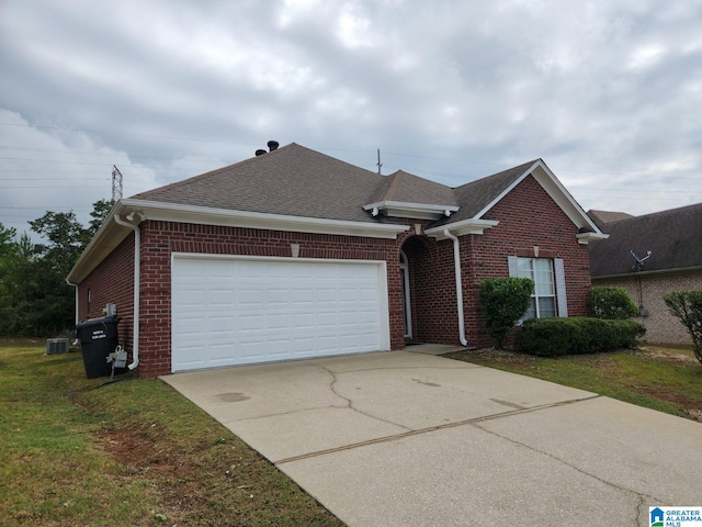 ranch-style house featuring driveway, an attached garage, a shingled roof, and brick siding