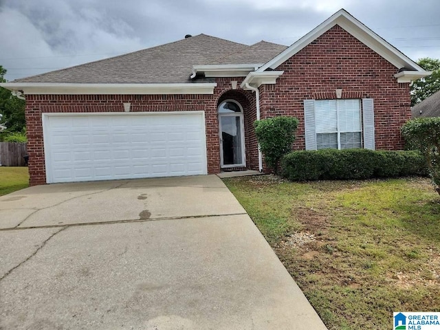 ranch-style house with driveway, brick siding, an attached garage, and a shingled roof