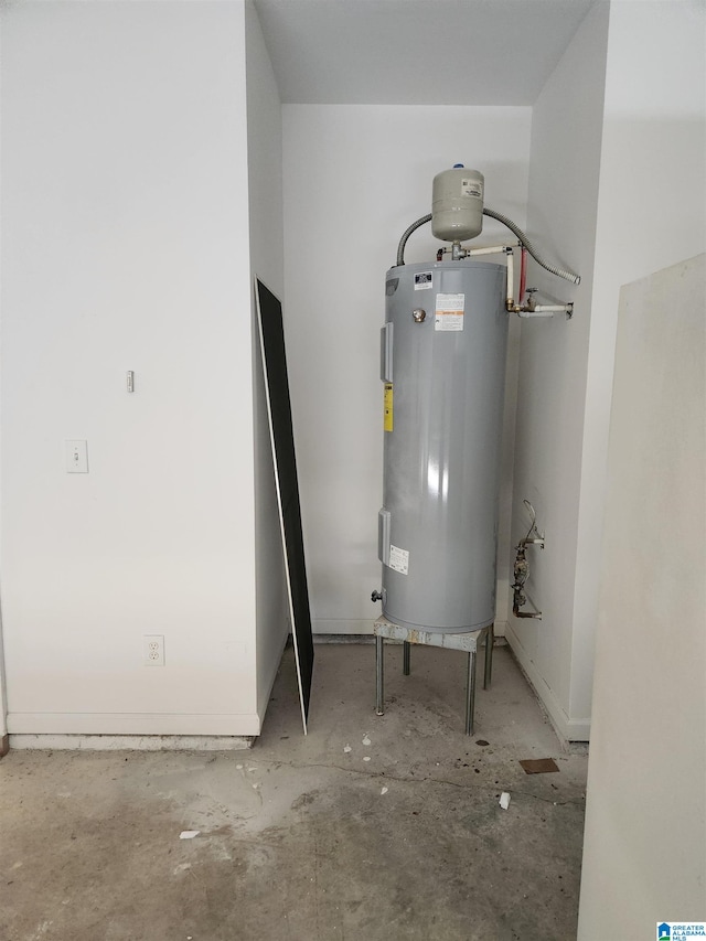 utility room with electric water heater