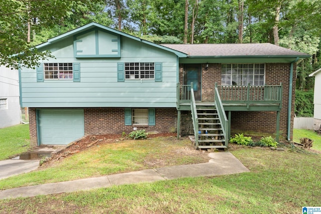 view of front of property with a garage and a front yard