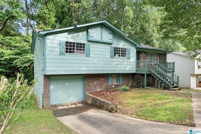 view of front of house with a garage and a front yard