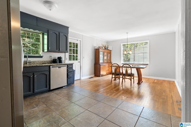 kitchen with sink, crown molding, light stone counters, decorative light fixtures, and dishwasher