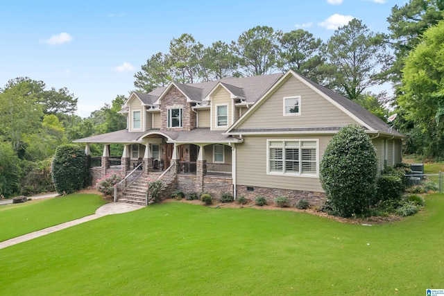 craftsman-style house featuring a front lawn and covered porch