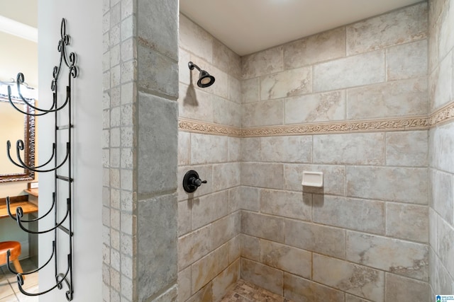 bathroom with tile patterned floors, crown molding, and vanity