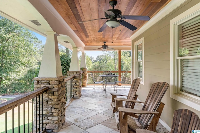 view of front of home featuring a garage, covered porch, and a front yard