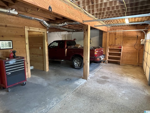 garage featuring wooden walls