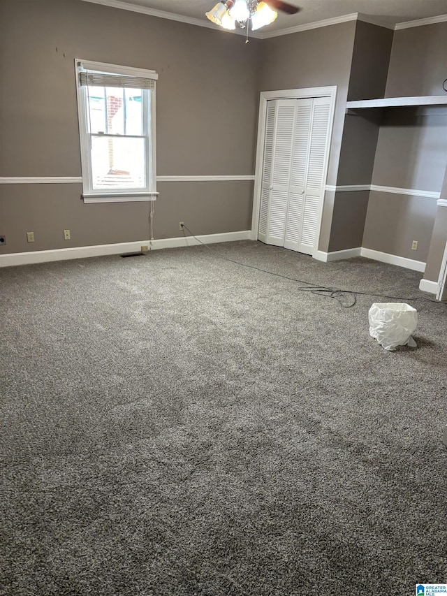 unfurnished bedroom featuring ceiling fan, ornamental molding, and a closet