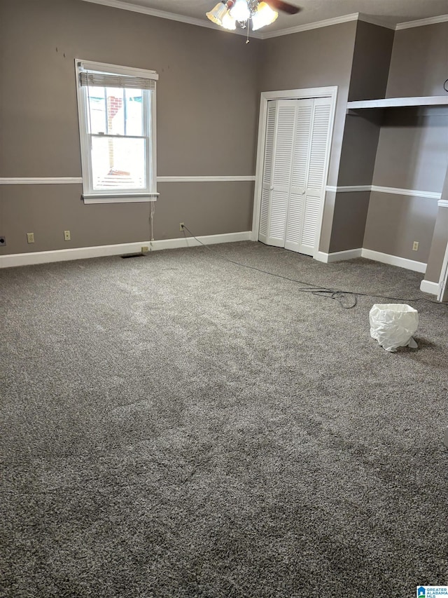 unfurnished bedroom with a closet, ceiling fan, and crown molding