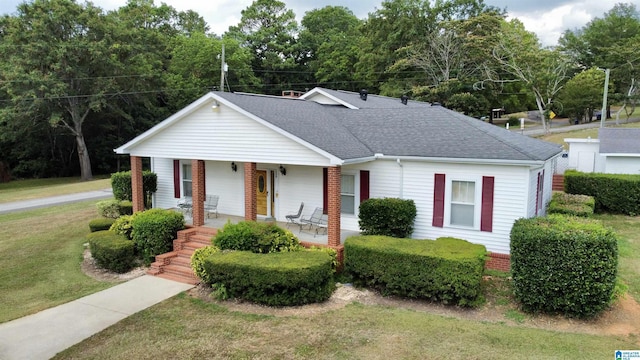 view of front of house with a front lawn and a porch