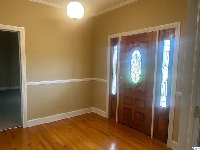 foyer featuring crown molding and wood-type flooring