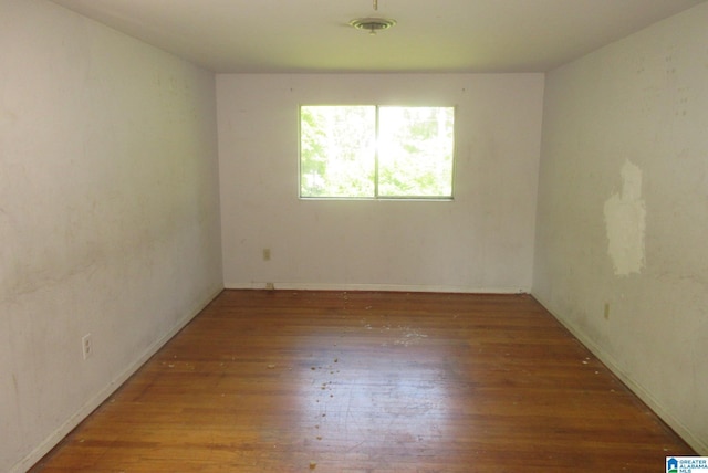 empty room with hardwood / wood-style floors