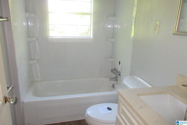 full bathroom featuring vanity, washtub / shower combination, and toilet