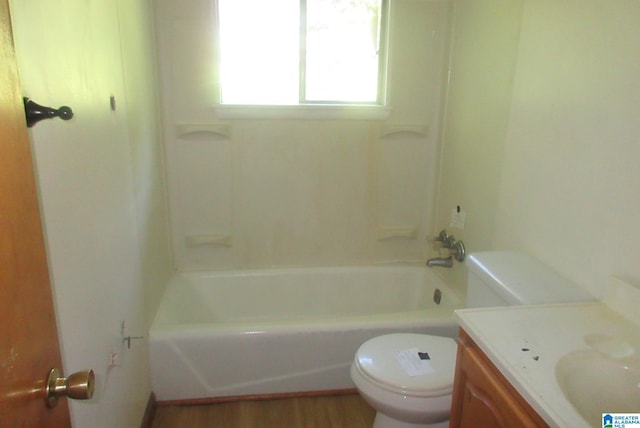 bathroom with hardwood / wood-style flooring, vanity, and toilet