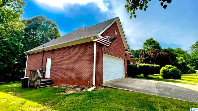 view of home's exterior featuring a garage and a yard