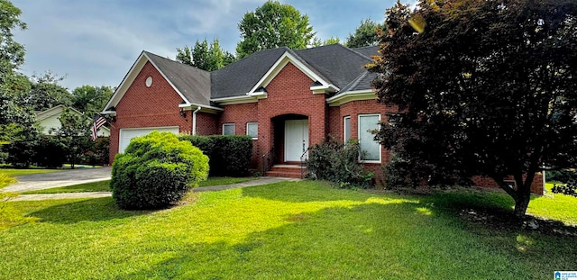 view of front of property featuring a garage and a front lawn