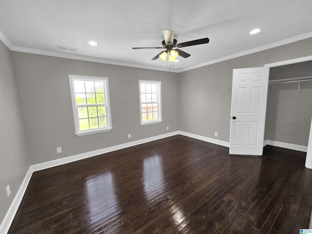 unfurnished bedroom featuring dark hardwood / wood-style flooring, a closet, ceiling fan, and crown molding