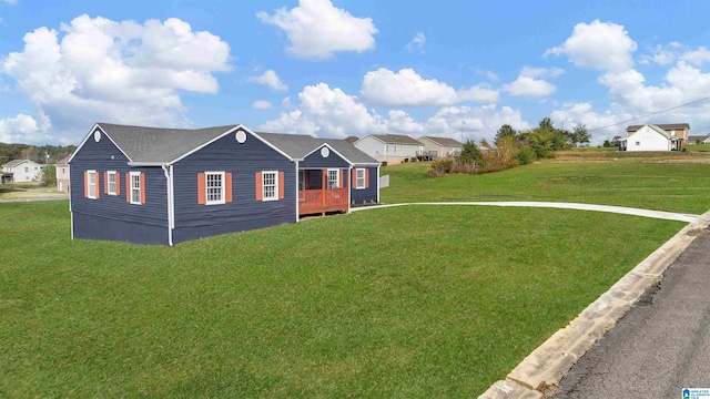 view of front facade featuring a front lawn and a wooden deck