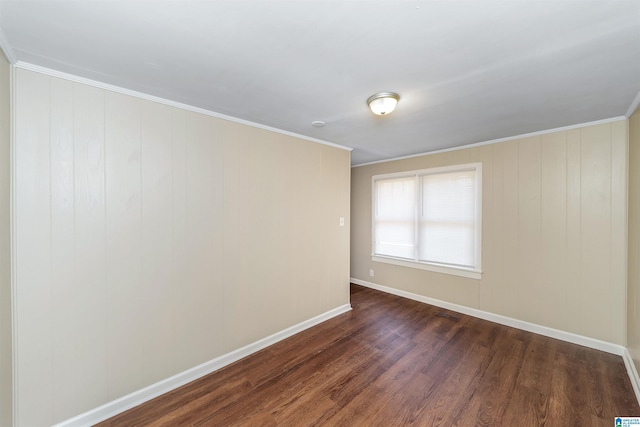 unfurnished room with dark wood-type flooring and crown molding