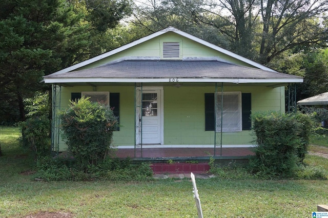 bungalow featuring a porch and a front yard