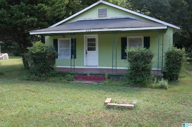 view of front facade with a porch and a front yard