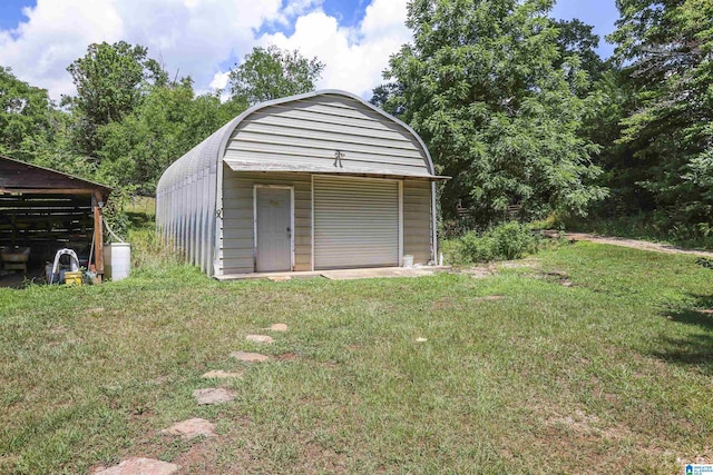 view of outdoor structure featuring a yard