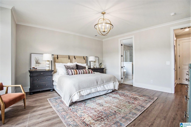 bedroom featuring a notable chandelier, baseboards, and wood finished floors