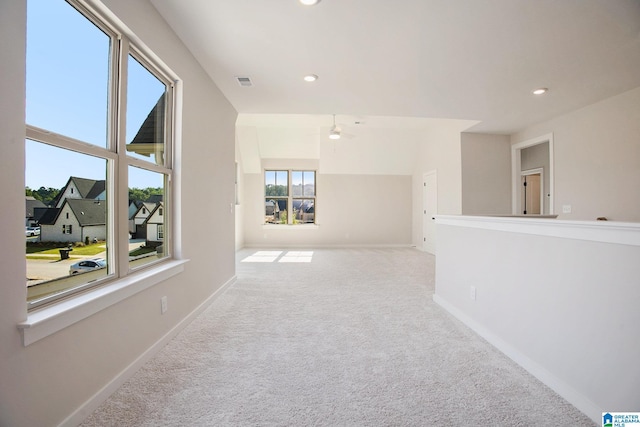 unfurnished room featuring baseboards, recessed lighting, visible vents, and light colored carpet