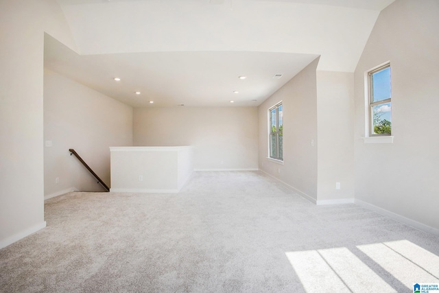 empty room with recessed lighting, baseboards, and light colored carpet