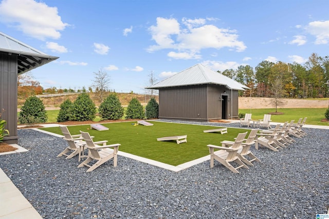 view of yard featuring a patio and an outdoor structure