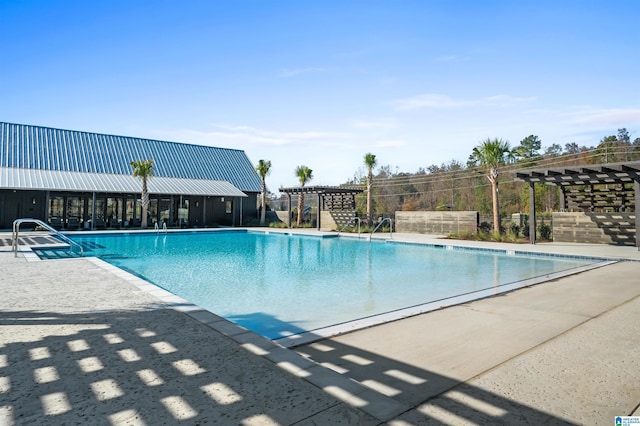 community pool with a pergola and a patio