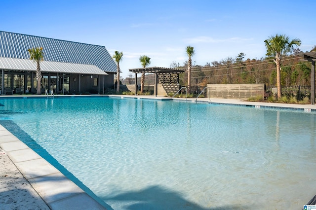 community pool with fence and a pergola