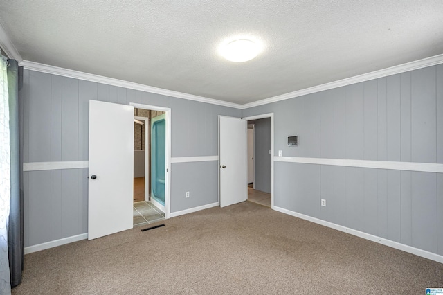 unfurnished bedroom featuring a textured ceiling, light colored carpet, and crown molding