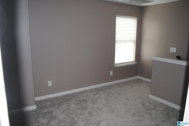 unfurnished room with light carpet and a healthy amount of sunlight