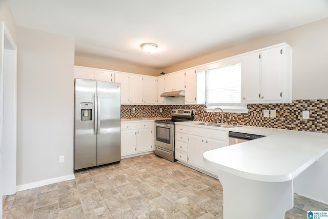 kitchen featuring white cabinets, appliances with stainless steel finishes, kitchen peninsula, and sink