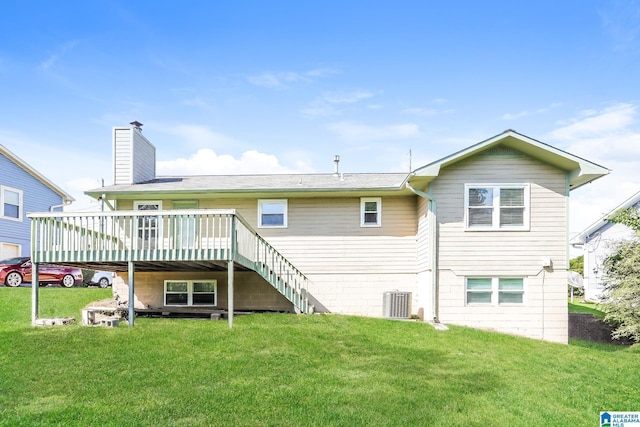 back of property featuring a yard, a deck, and central AC unit