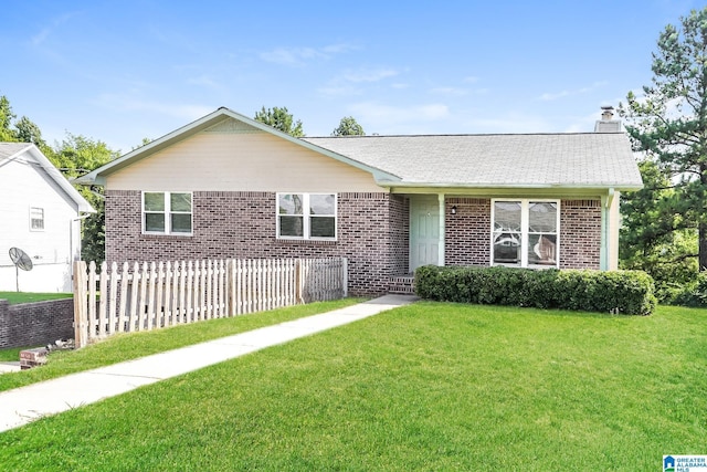 ranch-style house with a front yard