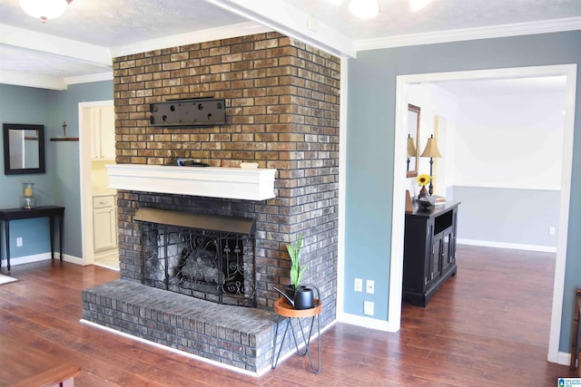 living room featuring dark wood-style floors, a brick fireplace, and crown molding