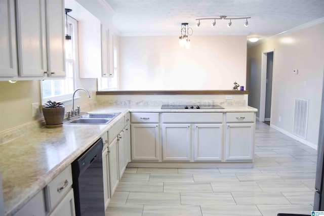 kitchen featuring visible vents, ornamental molding, black appliances, white cabinetry, and a sink