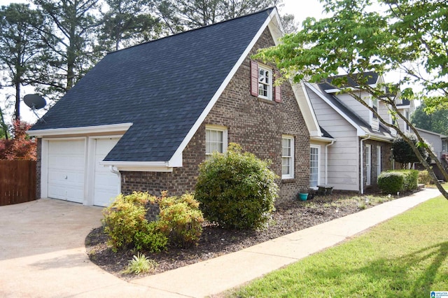 view of property exterior featuring a garage, a shingled roof, fence, and brick siding