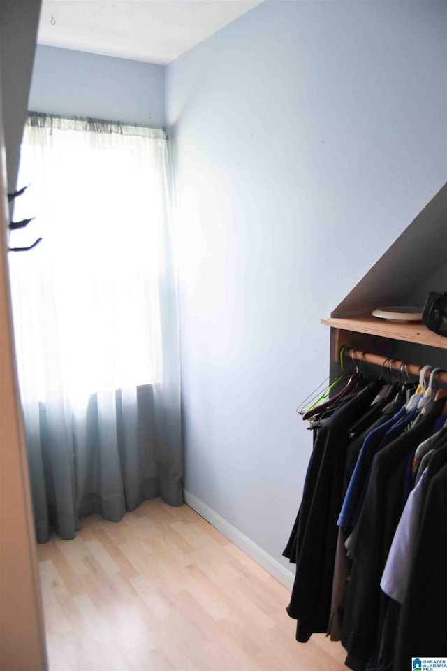 walk in closet featuring light wood-type flooring