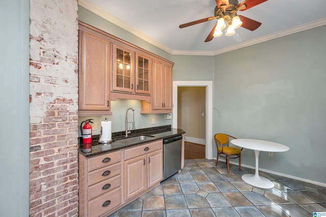 kitchen featuring dark stone countertops, sink, ornamental molding, and stainless steel dishwasher