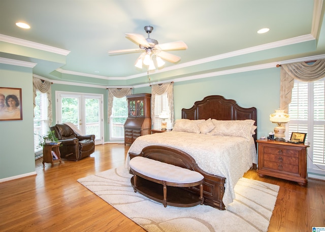 bedroom with ceiling fan, wood-type flooring, crown molding, and access to outside